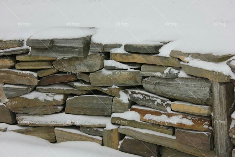 Snow covered rock wall.