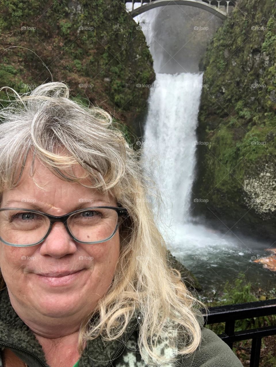 Woman by a waterfall 
