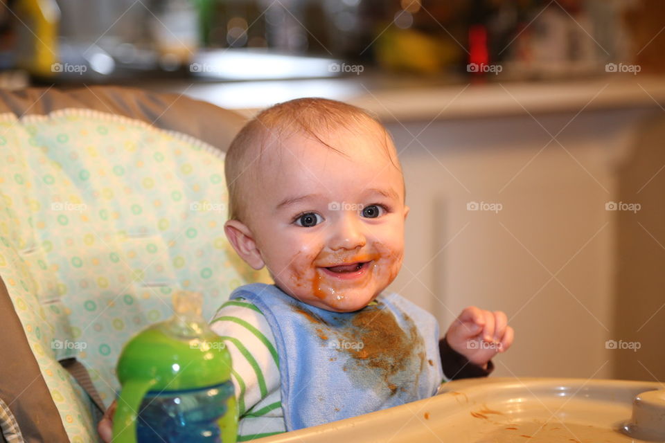 Messy baby eating.