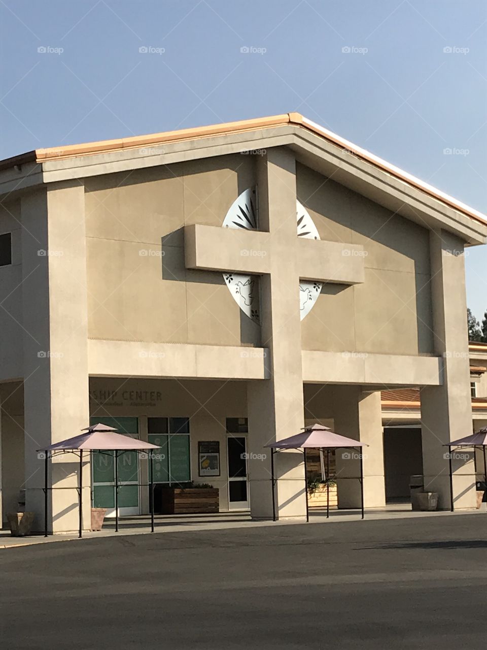 Building of the main sanctuary of a church. A very large cross adorns the front of the building. It fits right in perfectly.