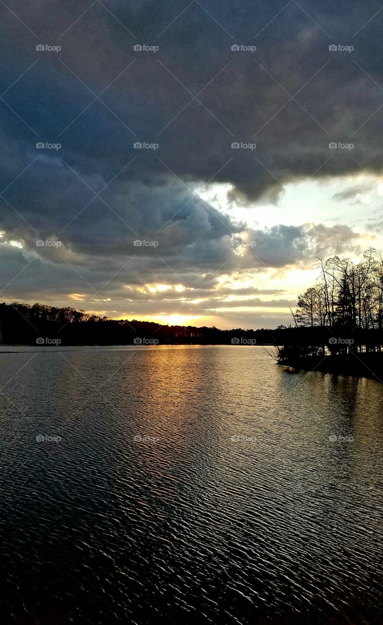 dusk as a storm comes in by the lake.