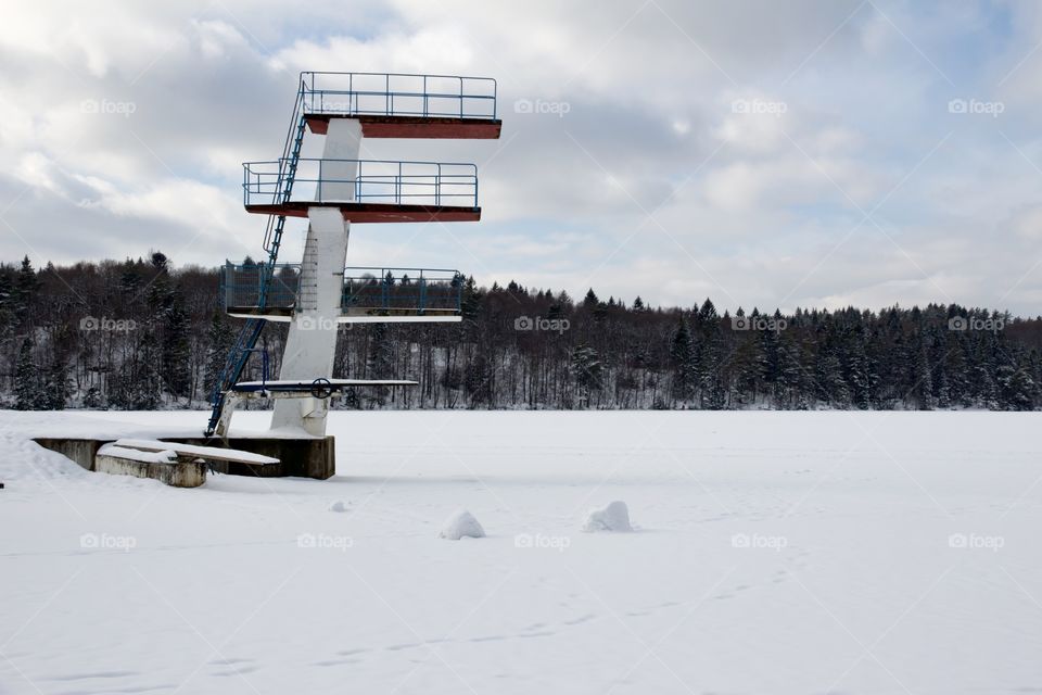 Longing for summer. Beach and diving tower in snow, Sweden - längtar efter sommar. Badplats med strand och hopptorn i snö, kåsjön , Partille, Sweden