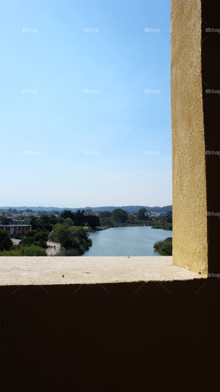 Window overlooking a small lake.