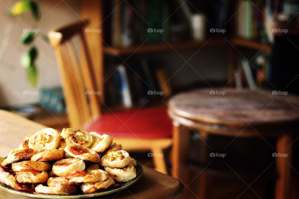 View of a living room with puff pastry on a table in the foreground