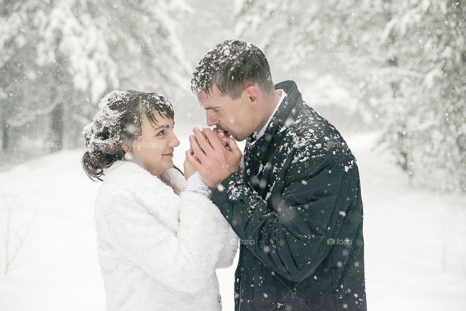 Couple holding each other's hand in winter