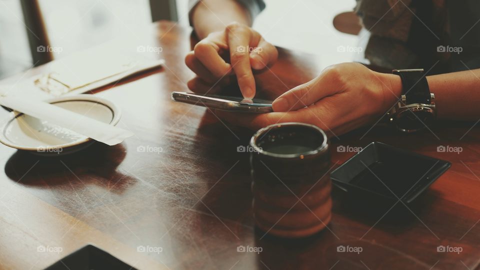 man playing smartphone