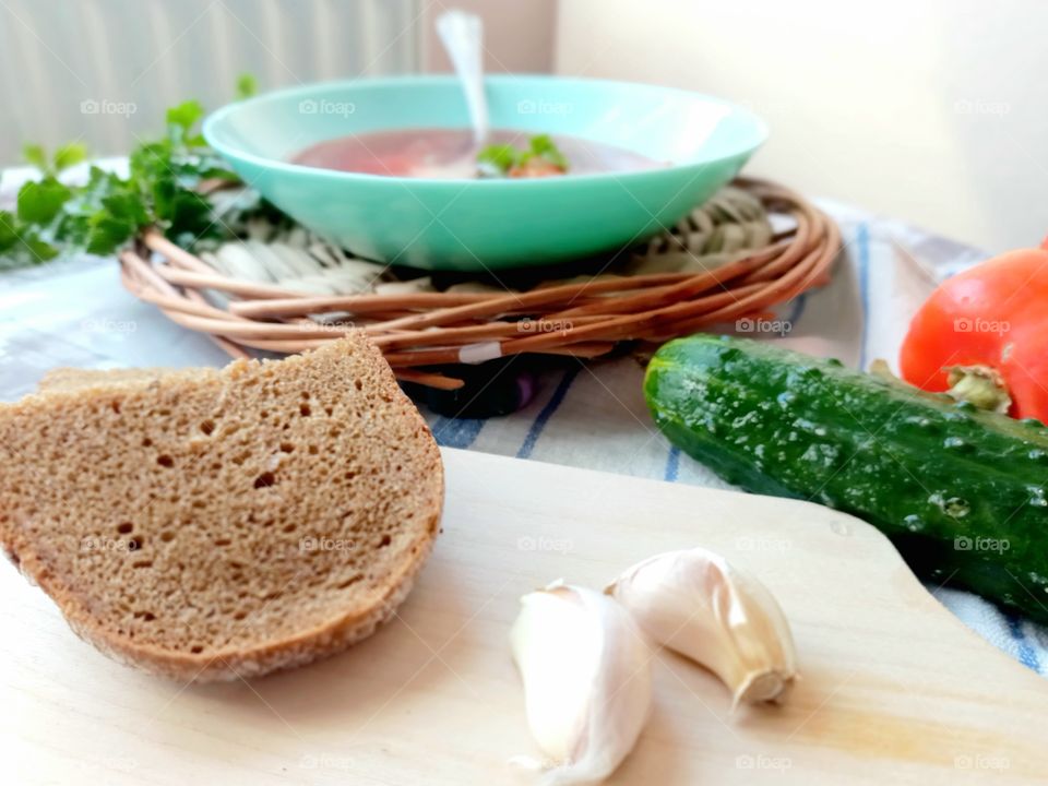 vegetable soup with cabbage - borsch, vegetables, herbs and rye bread for lunch