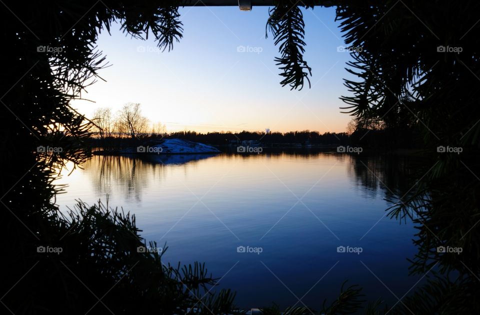 Icy and wintry Baltic Sea after sunset at Seurasaari island in Helsinki, Finland.