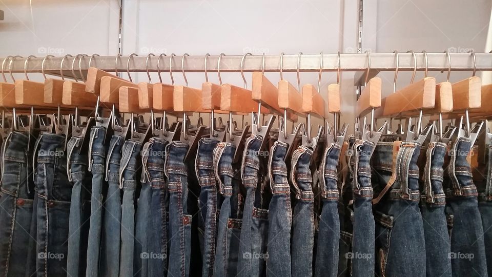 unisex clothing. jeans waiting for their owners