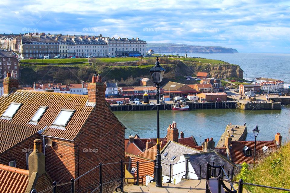 View from the long walk up the steps to Whitby Abbey. Looking out onto the harbour and the North Yorkshire coast with stunning views reaching long into the distance.