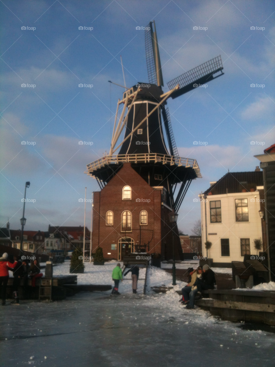 Dutch windmill. Haarlem in the winter. View of Haarlem's windmill from the frozen river. 