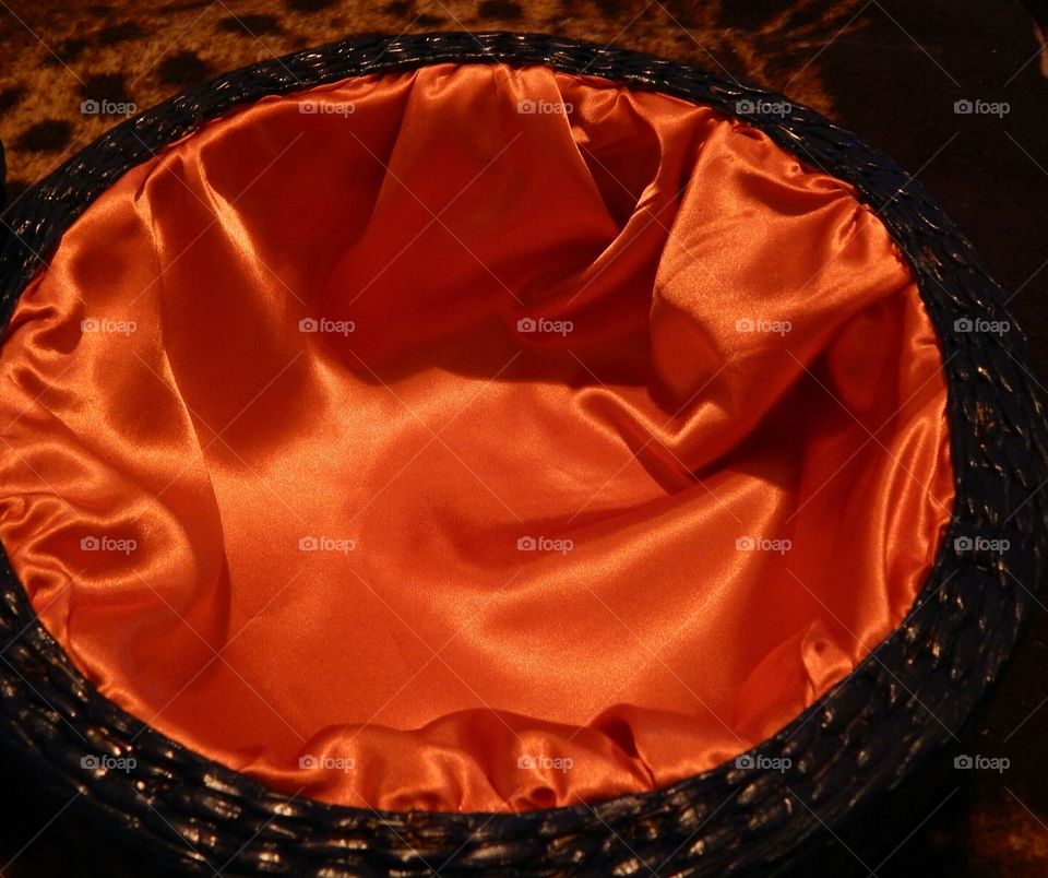orange satin inside an ottoman