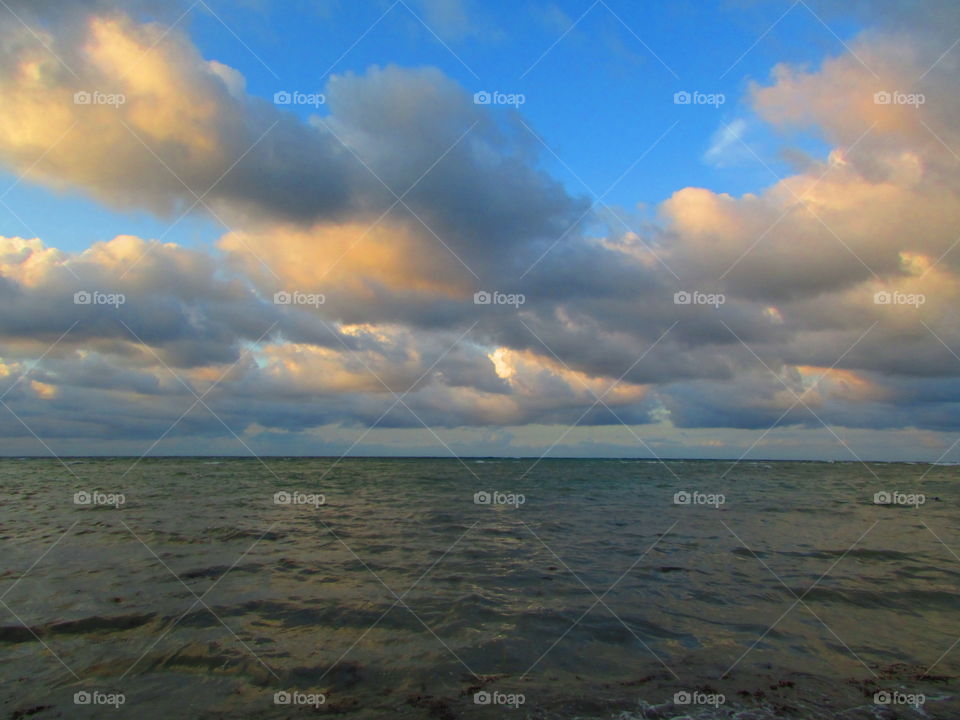 Scenic view of seascape against cloudy sky