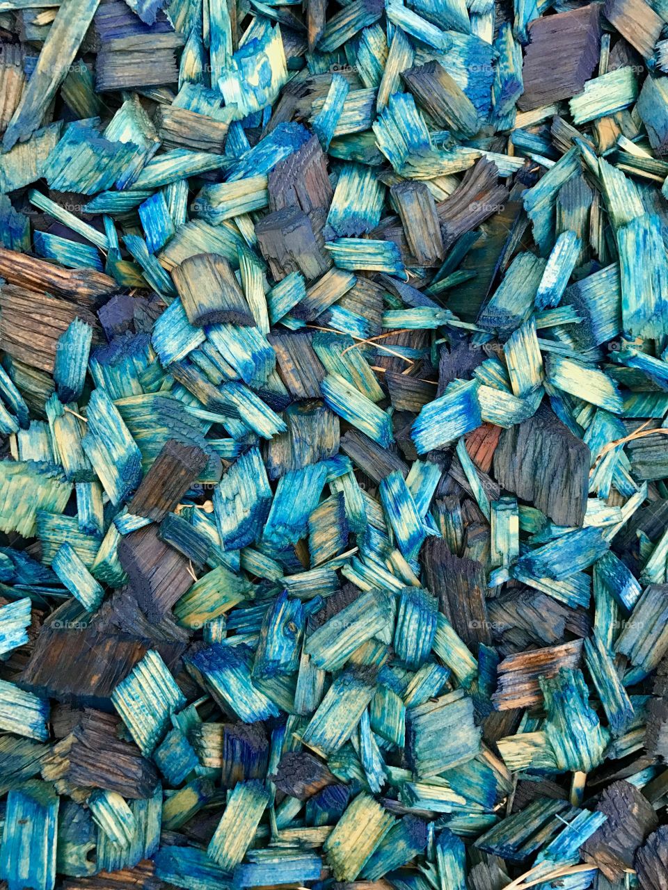 Small wooden pieces colored with blue 