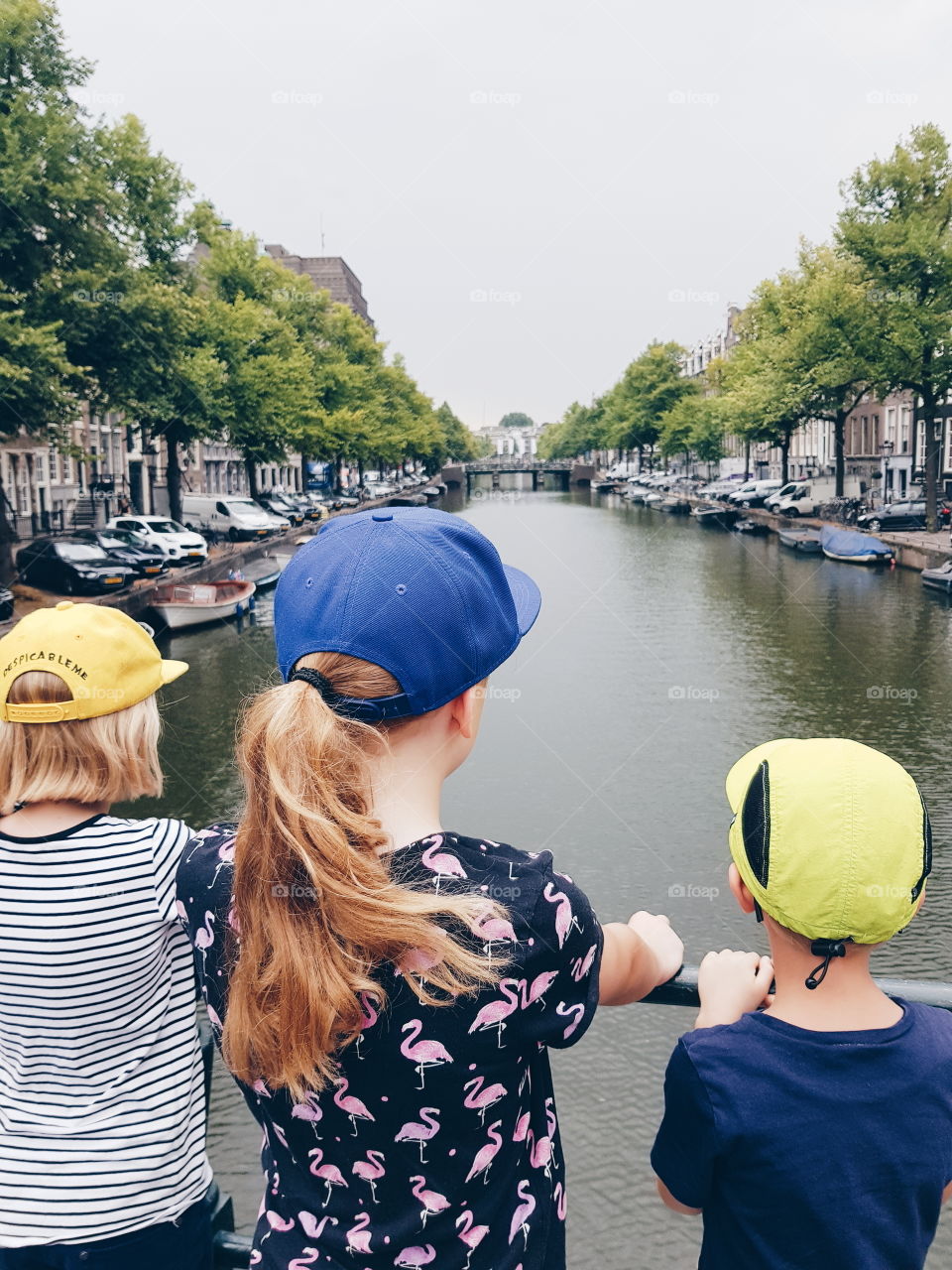 Travel with kids. City trip to Amsterdam with three kids. Summer in the city.