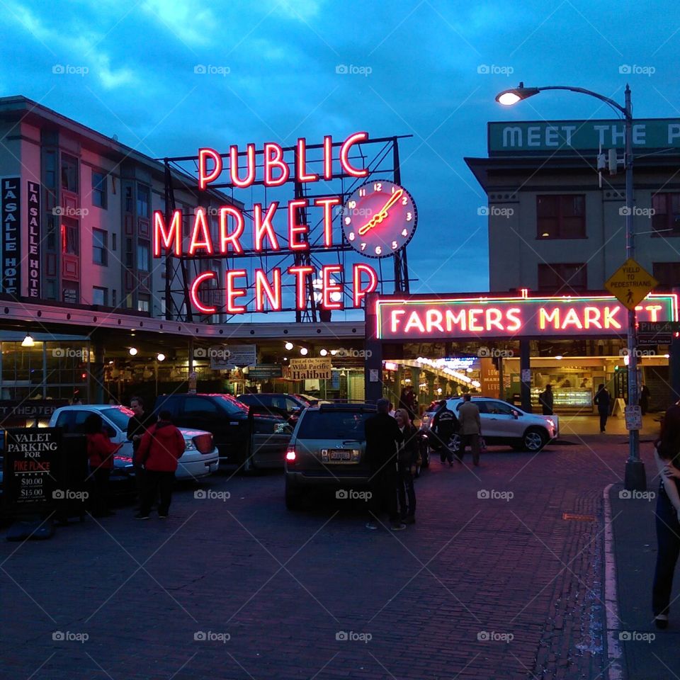 public market center in Seattle. caught the perfect time of night as the sun sat and the lights turned on at the historic pike place market in Seattle