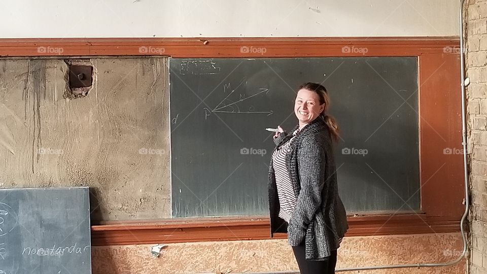beautiful teacher teaching in lost abandoned school room looks beautiful howed thos kids learn anything