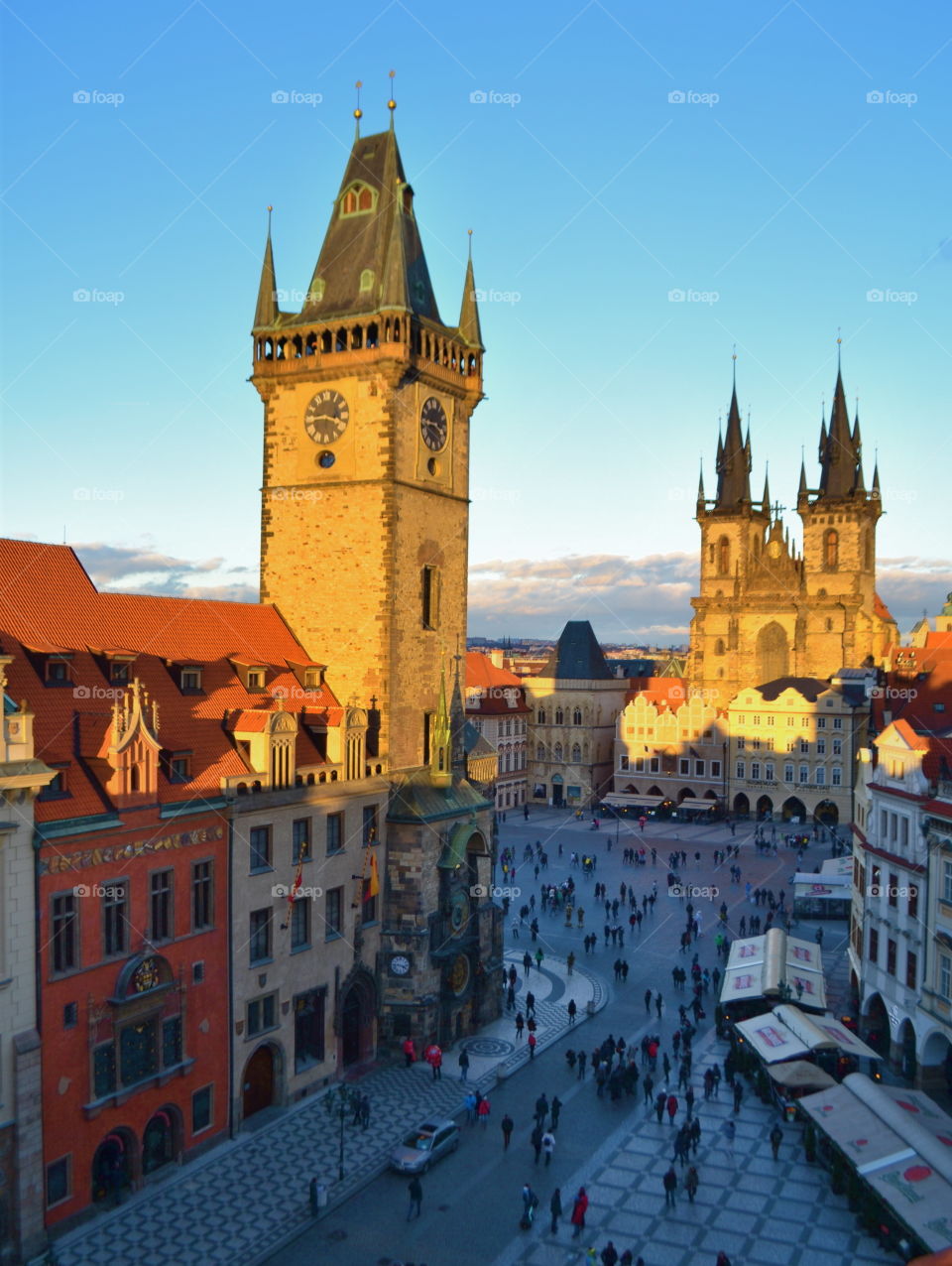 Prague. a golden envelope of sunset of Prague's most famous square on a cold wintry afternoon taken from Terasa U Hotel