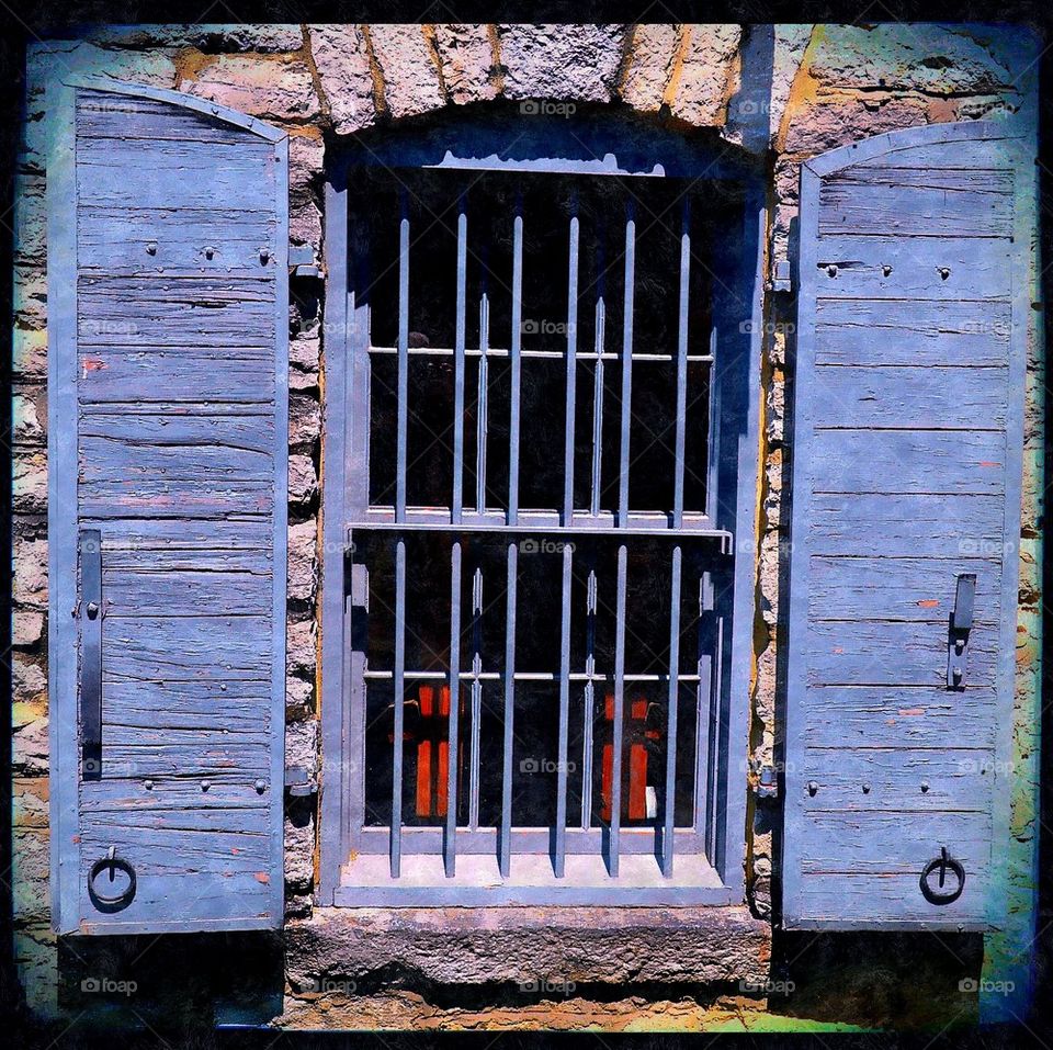 blue shutters on window