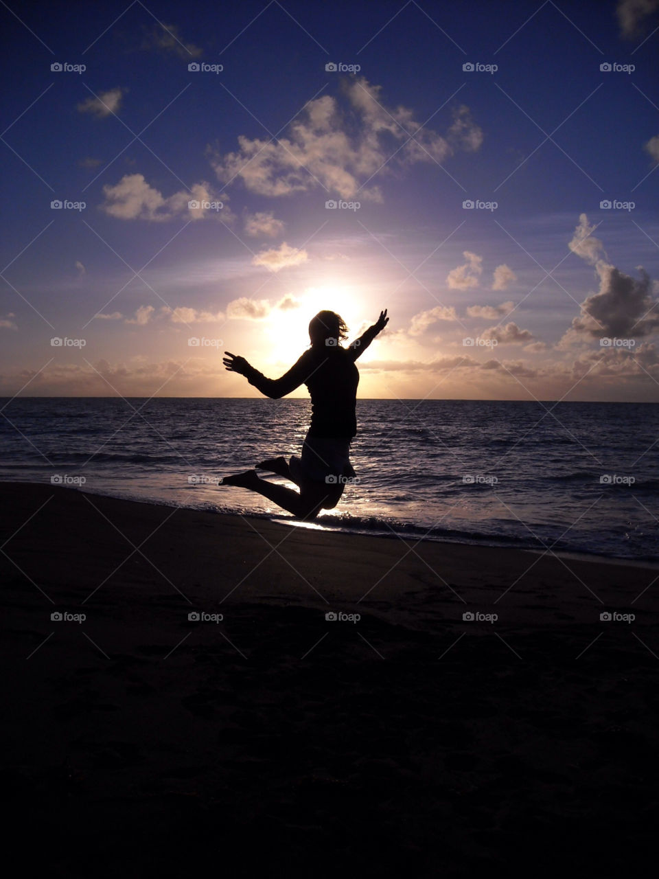 beach sunrise silhouette jump by sergioesteban