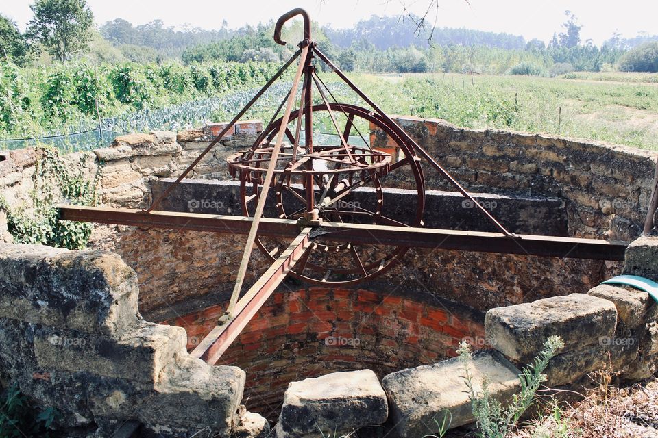 An old working well located on the farmland 