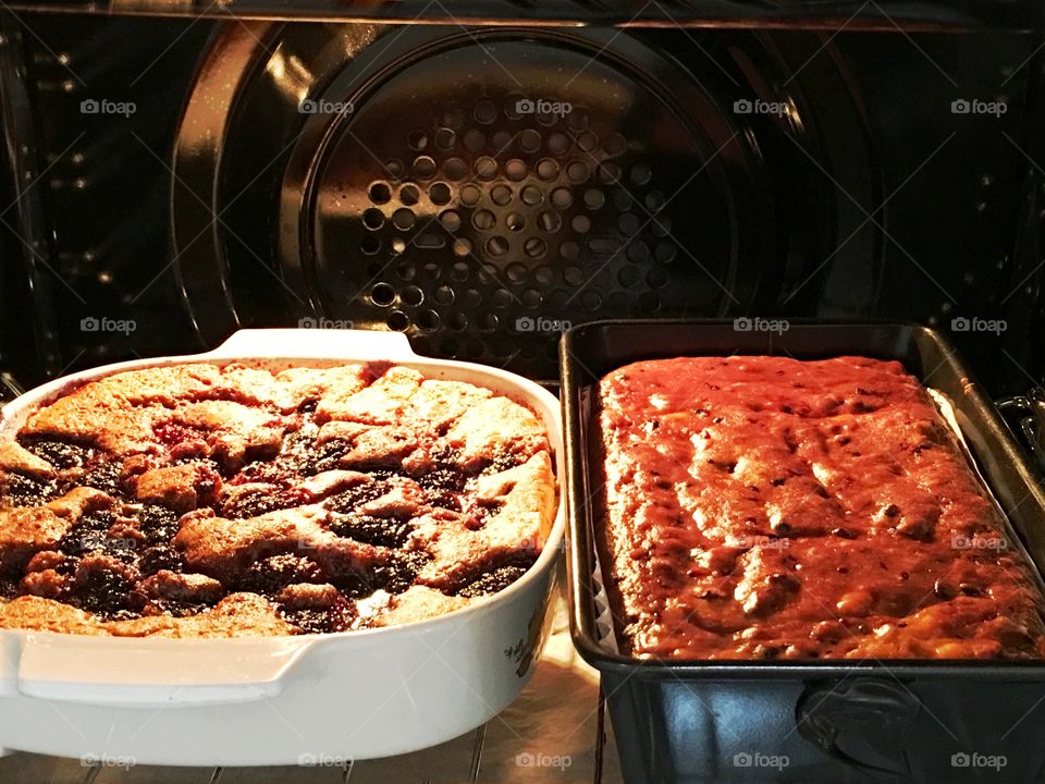 Desserts baking in oven . Yummy desserts baking in the oven. A mulberry fruit cobbler and mulberry banana bread (see mulberry photos)