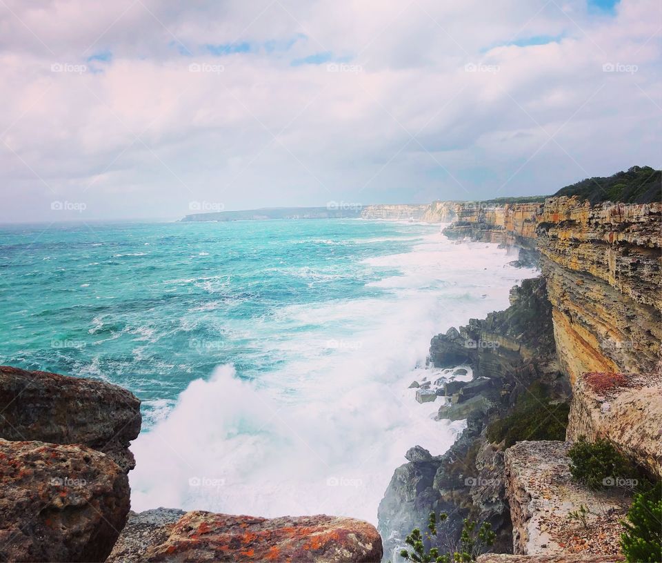 Cliff Edge drop to the tumultuous ocean on a rough day