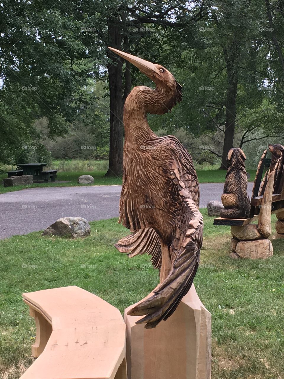 Beautiful wood carving of a Crain gracefully opening his wings 