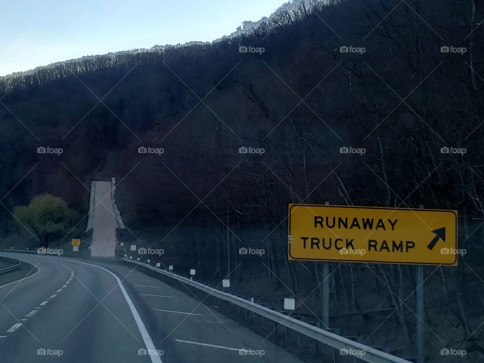 Runaway Truck Ramp Sign and Ramp coming down a Mountain