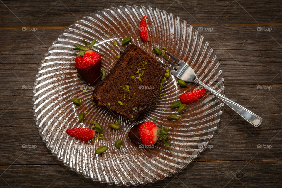 glas plate and a chocolate cake