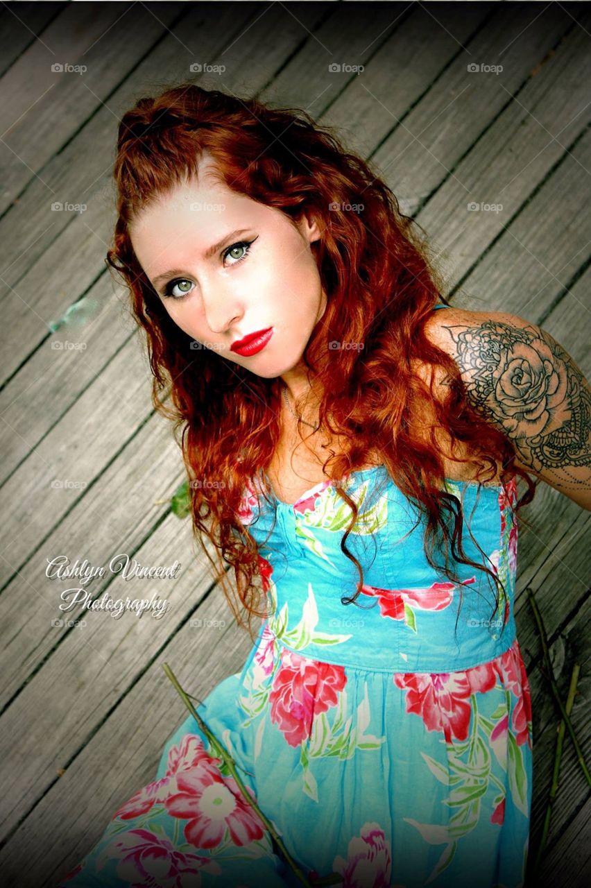 Red head with tattoo