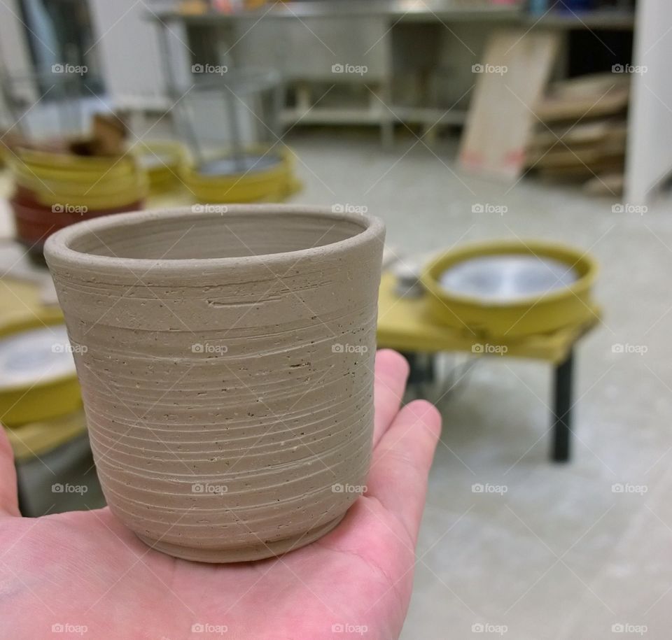 Unfired teacup just after trimming.