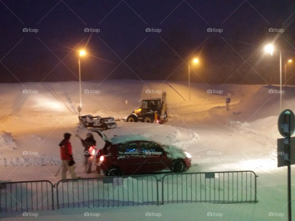 snow and car in front of hotel