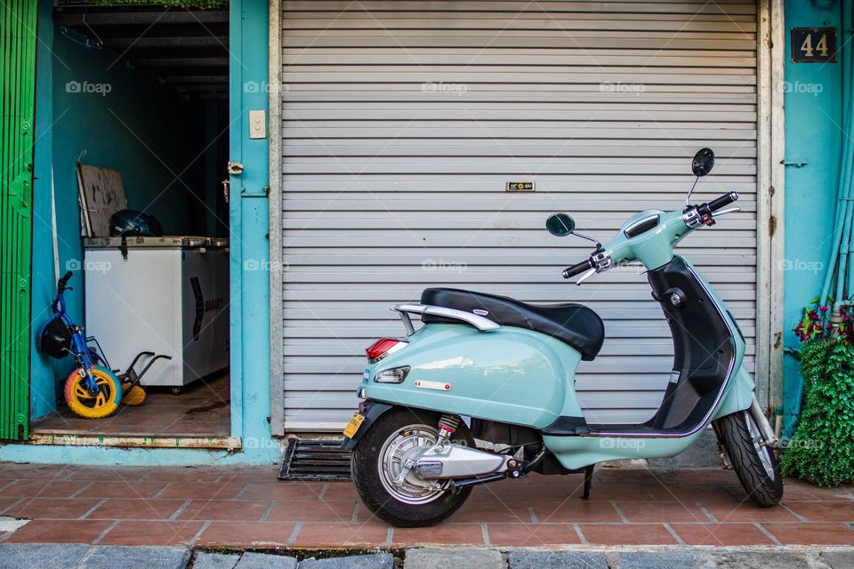 Motorbike parked near the house 