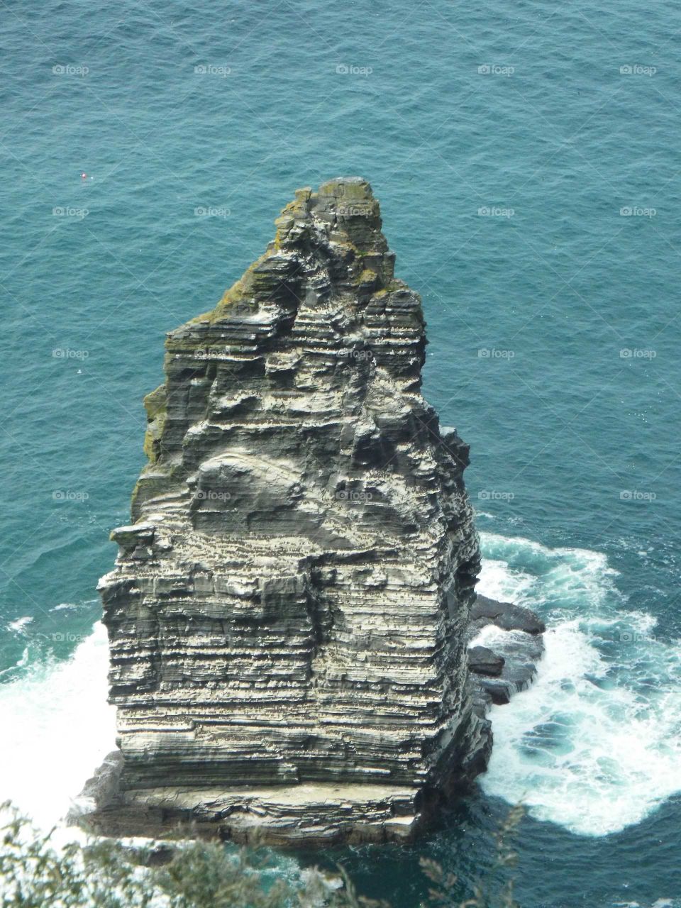 One of the large rocks off of the shore of the Cliffs of Moher in Ireland.