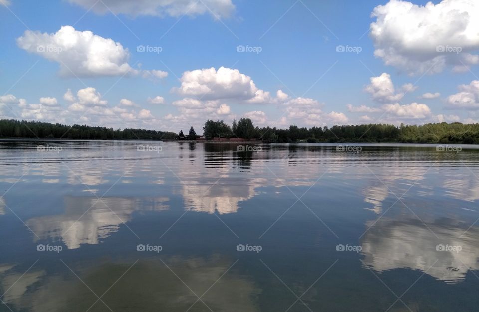 lake summer landscape and sky clouds reflection