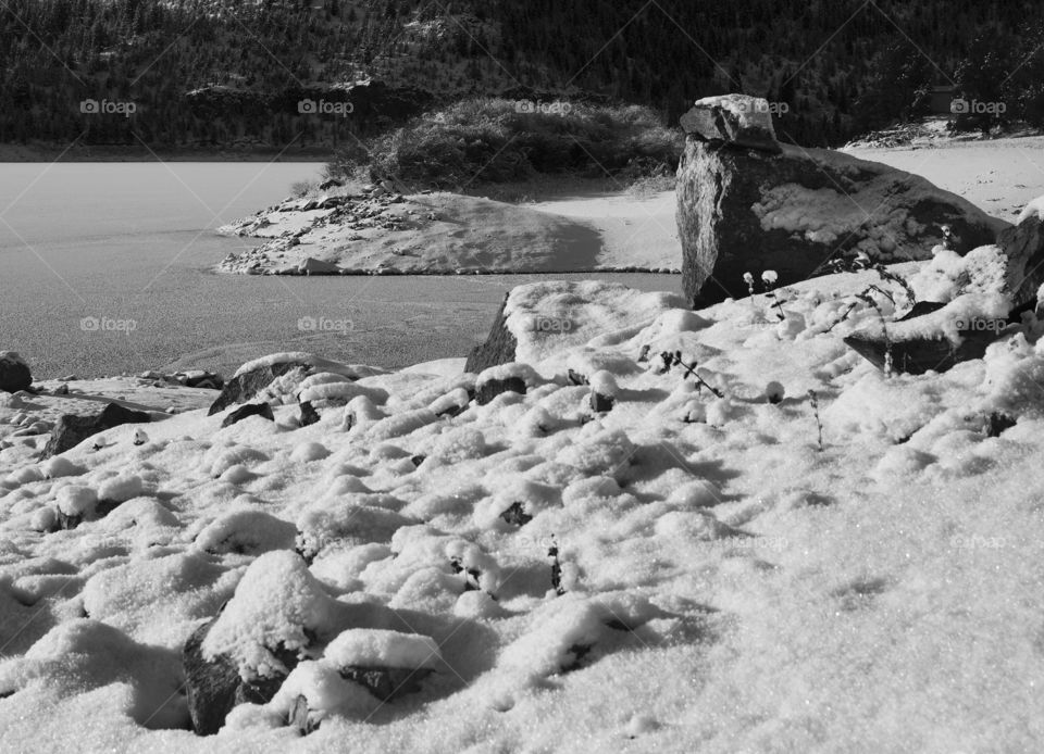 Snow covered rocky shores of Ochoco Reservoir in Central Oregon 