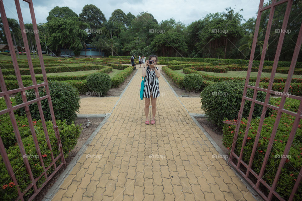 Asian girl talking a picture