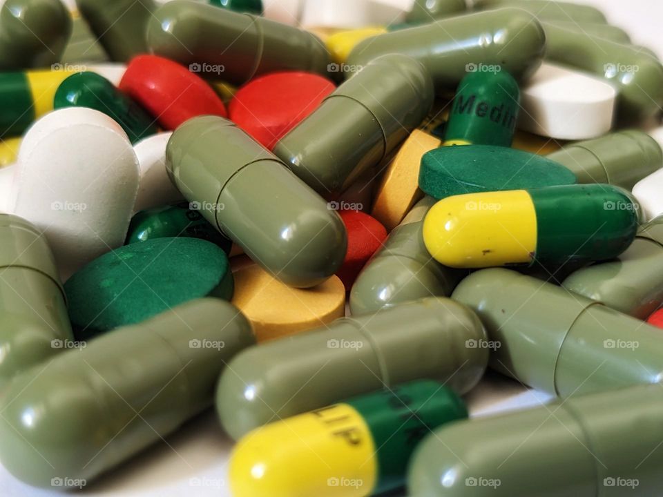 multicolored medicines on isolated white background