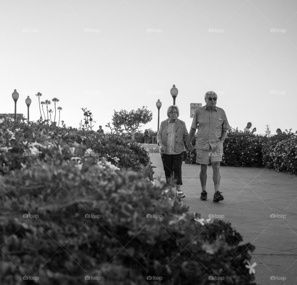 Black and white old couple walking