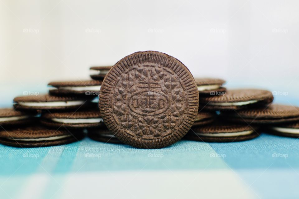 Oreo cookie thins on a white and light blue background 