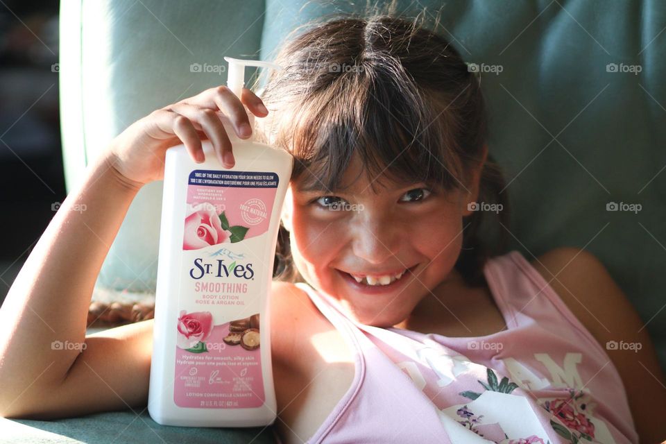 St.Ives beauty product in child's hand