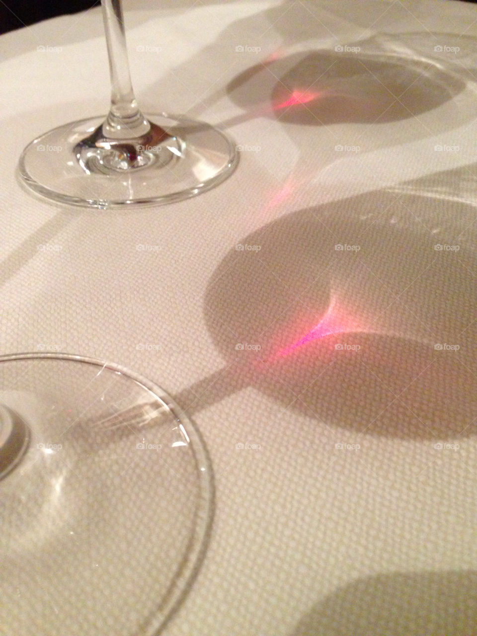 Light through wine glasses.