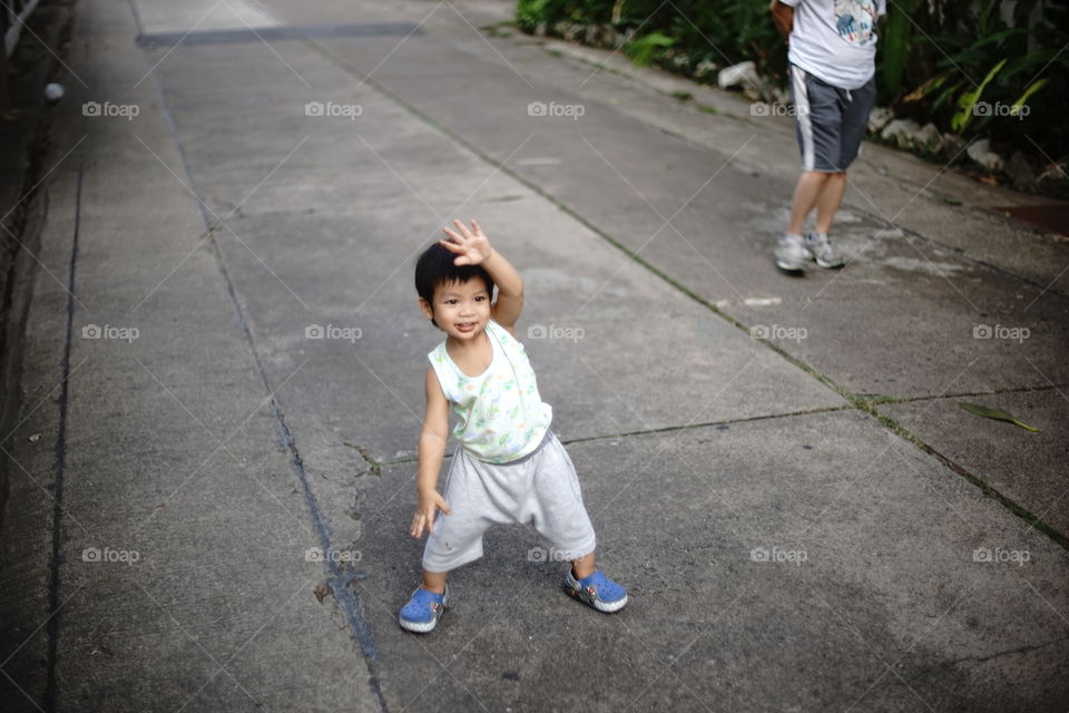 Asian boy exercising on the street 