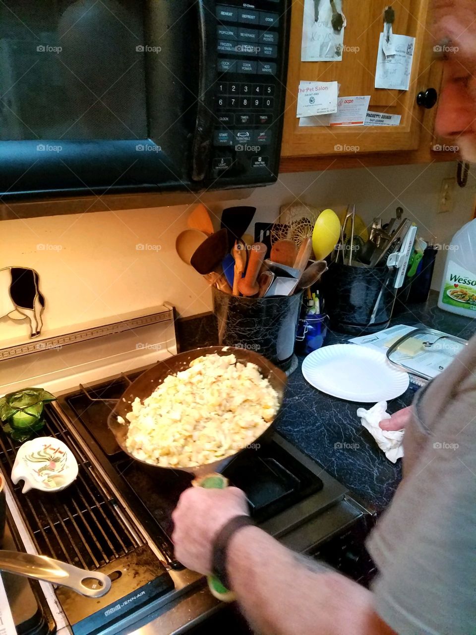 #stayathome - cooking at home. Breakfast for the family cooked by the man of the house. Pan of scrambled eggs.