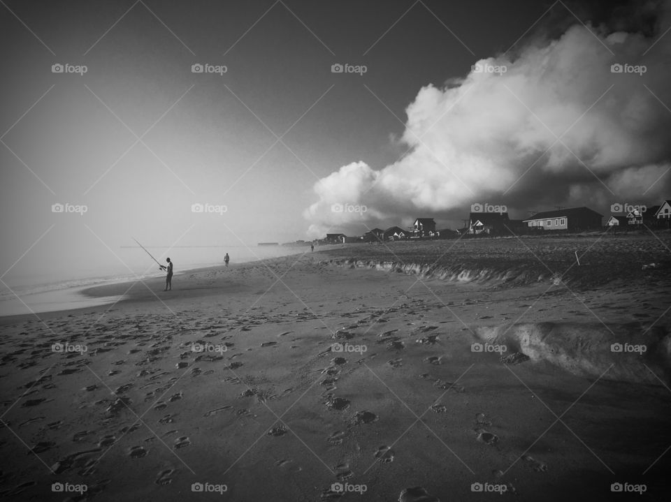 Foggy morning walk on the beach