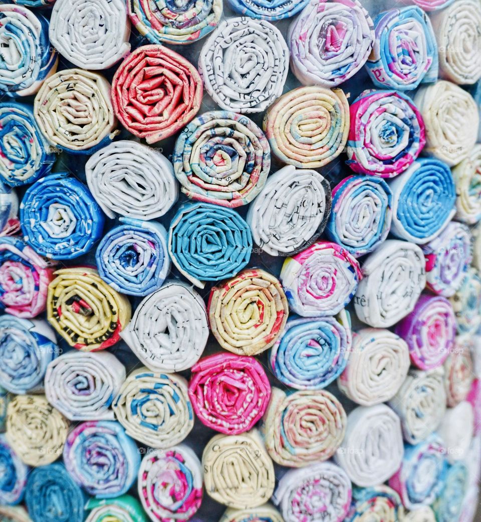 Rolled up pieces of colourful paper 