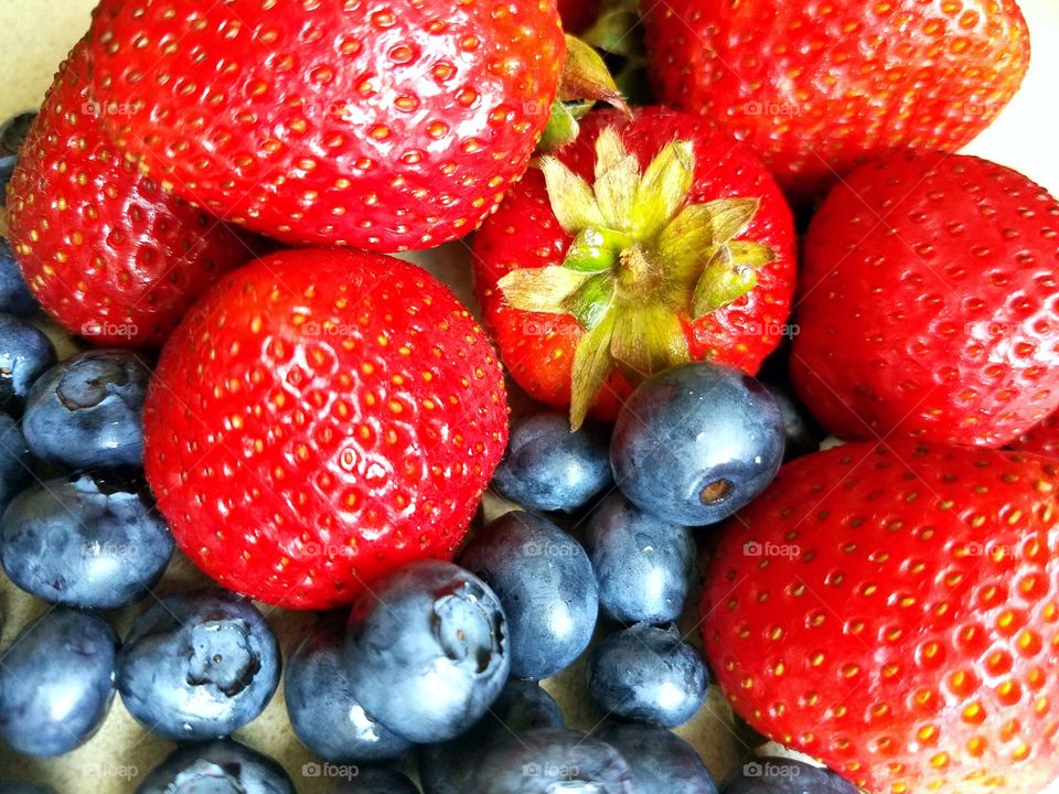 Close-up of a strawberry and blueberries