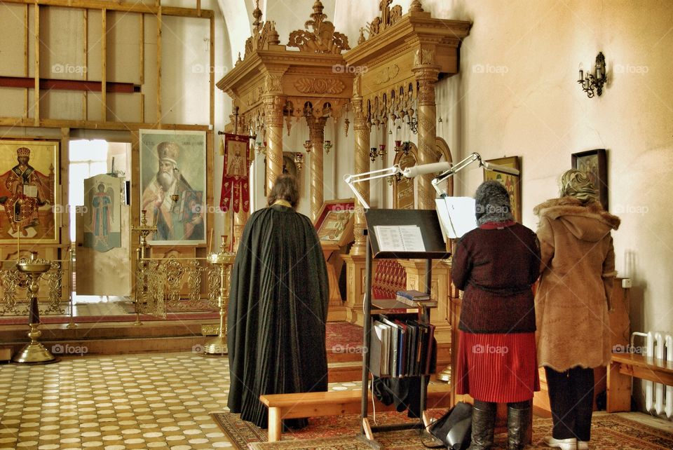 Service. . I took this photo sometime ago at one provincial town in Russia. That church building was pretty empty and nobody paid attention ruin to me while I was standing behind them. I hope you could feel the atmosphere. 