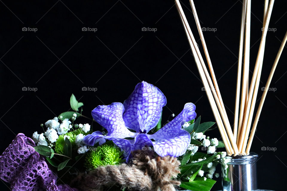 Scented sticks and floral arrangement